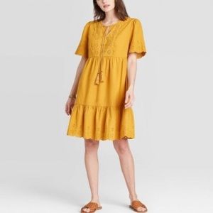 Eyelet-Trim Mini Dress with Tassel Tie in Mustard